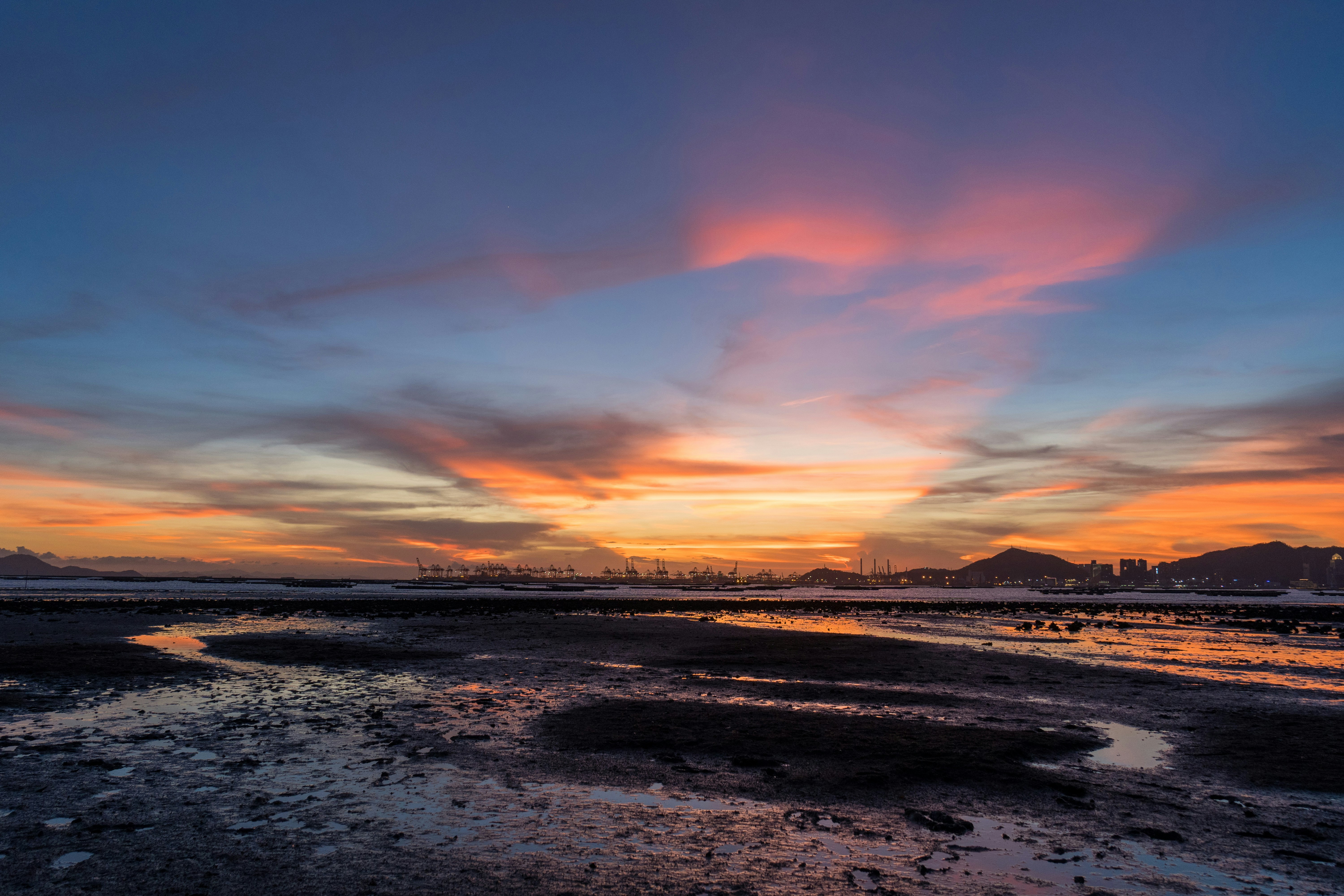 body of water during sunset